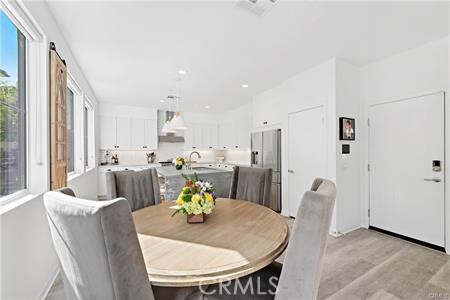 945 Sunlit Lane Costa Mesa, CA 92626 - Photo 9 of 31 a view of a dining room with furniture
