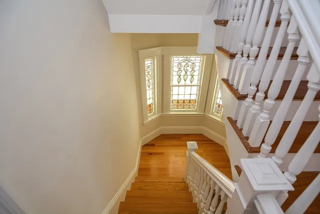a view of an entryway with wooden floor