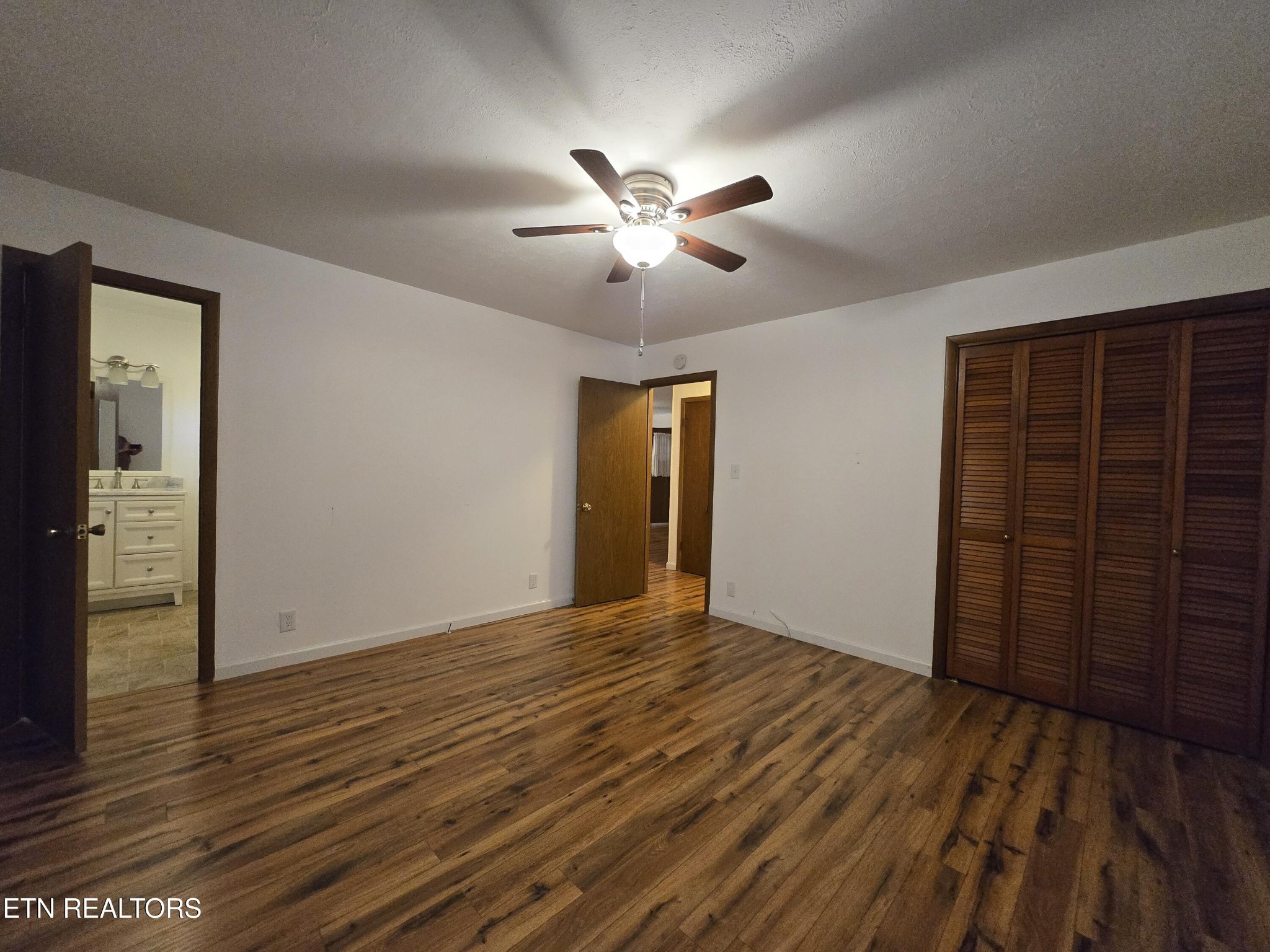 295 Bilbrey Road Crossville, TN 38571 - Photo 17 of 32 a view of an empty room with wooden floor