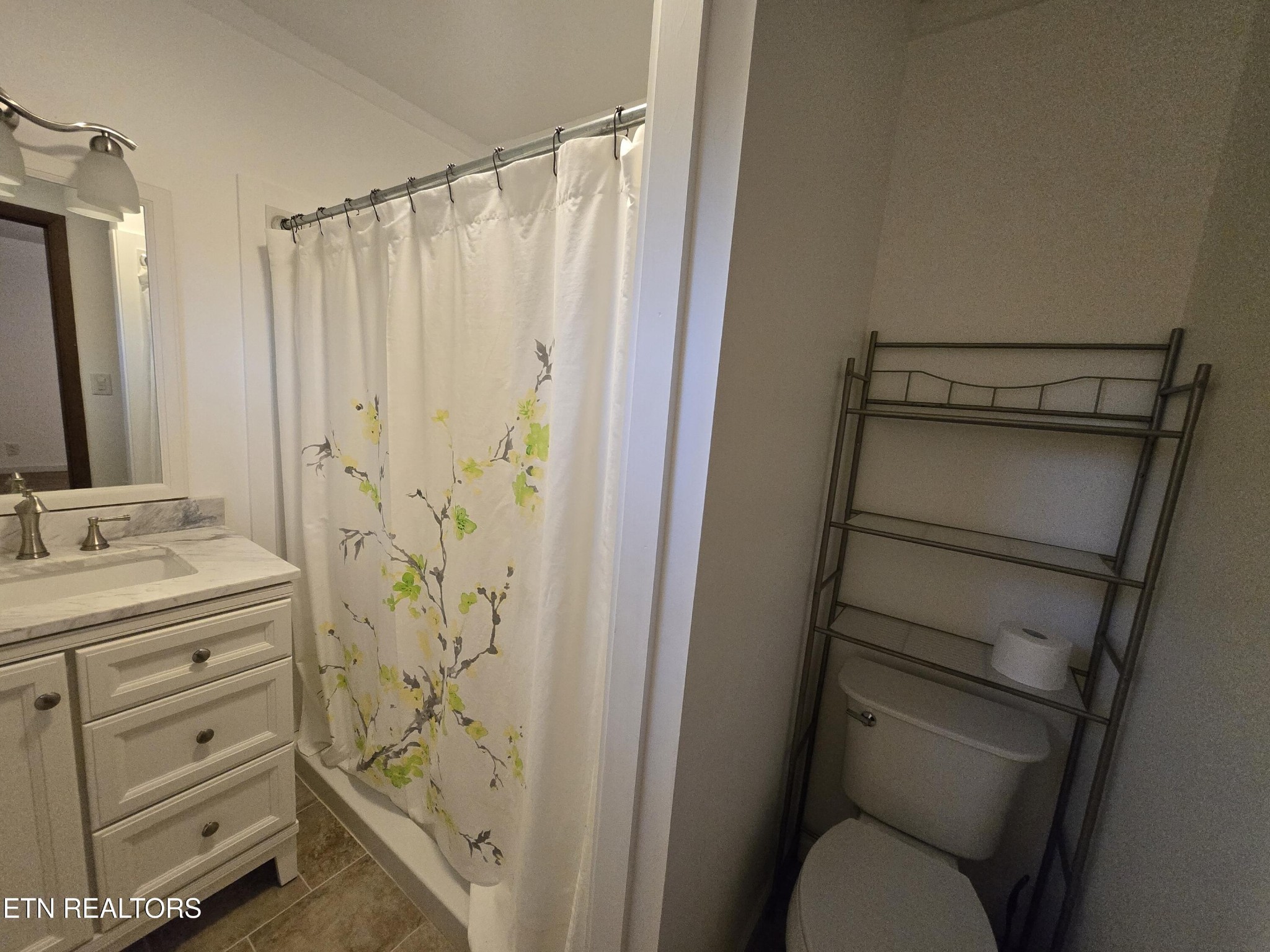 295 Bilbrey Road Crossville, TN 38571 - Photo 18 of 32 a bathroom with a shower toilet and sink