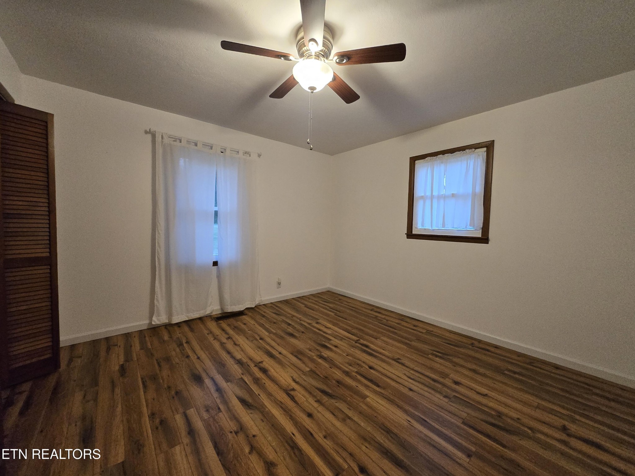295 Bilbrey Road Crossville, TN 38571 - Photo 19 of 32 a view of an empty room with wooden floor