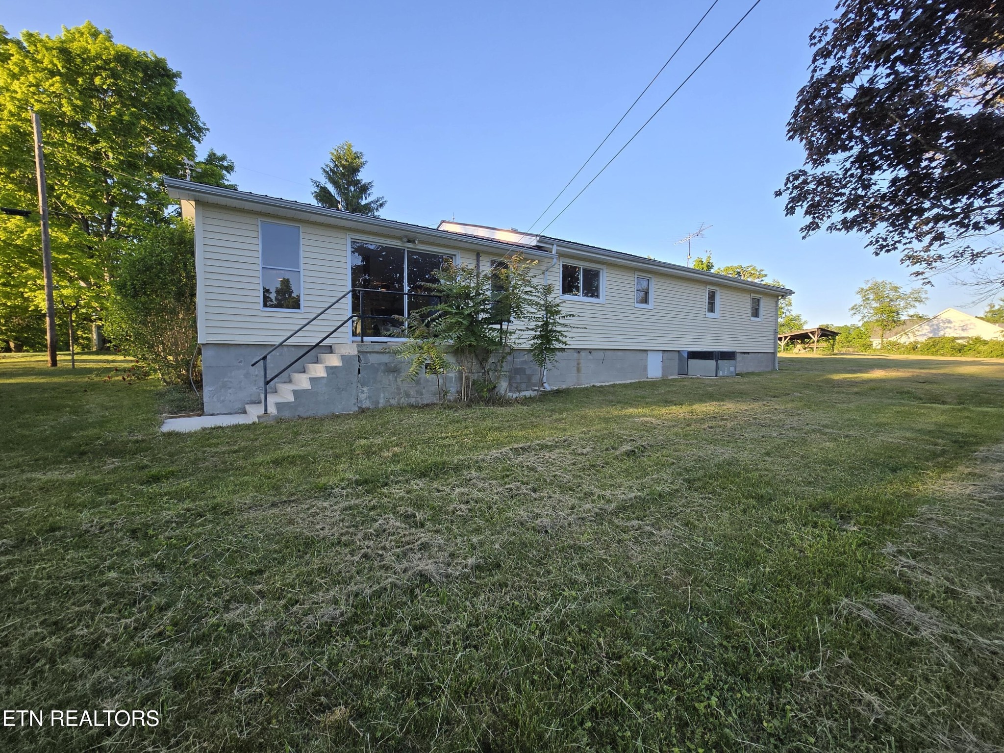 295 Bilbrey Road Crossville, TN 38571 - Photo 2 of 32 a view of a house with a back yard