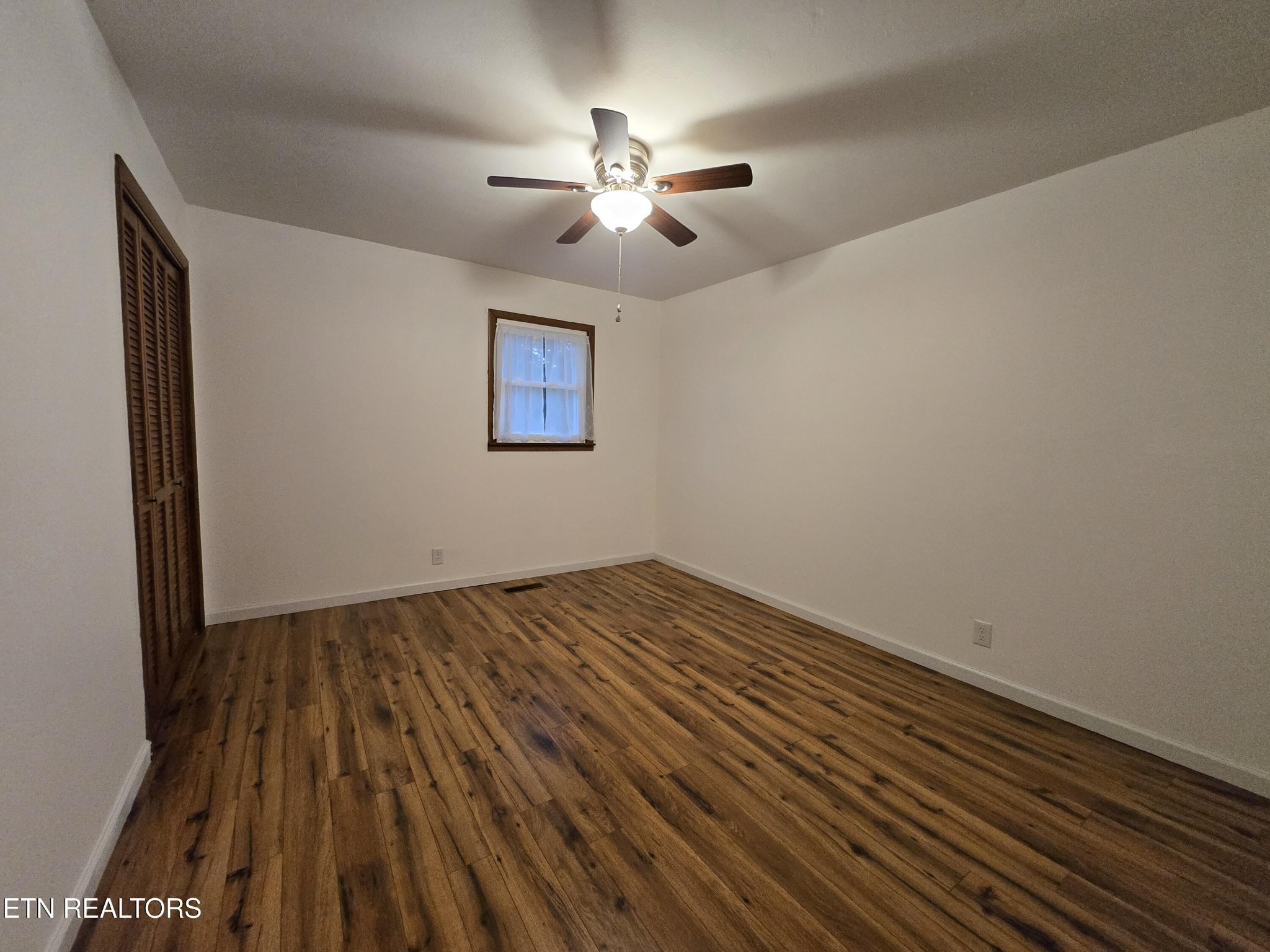 295 Bilbrey Road Crossville, TN 38571 - Photo 21 of 32 wooden floor in an empty room