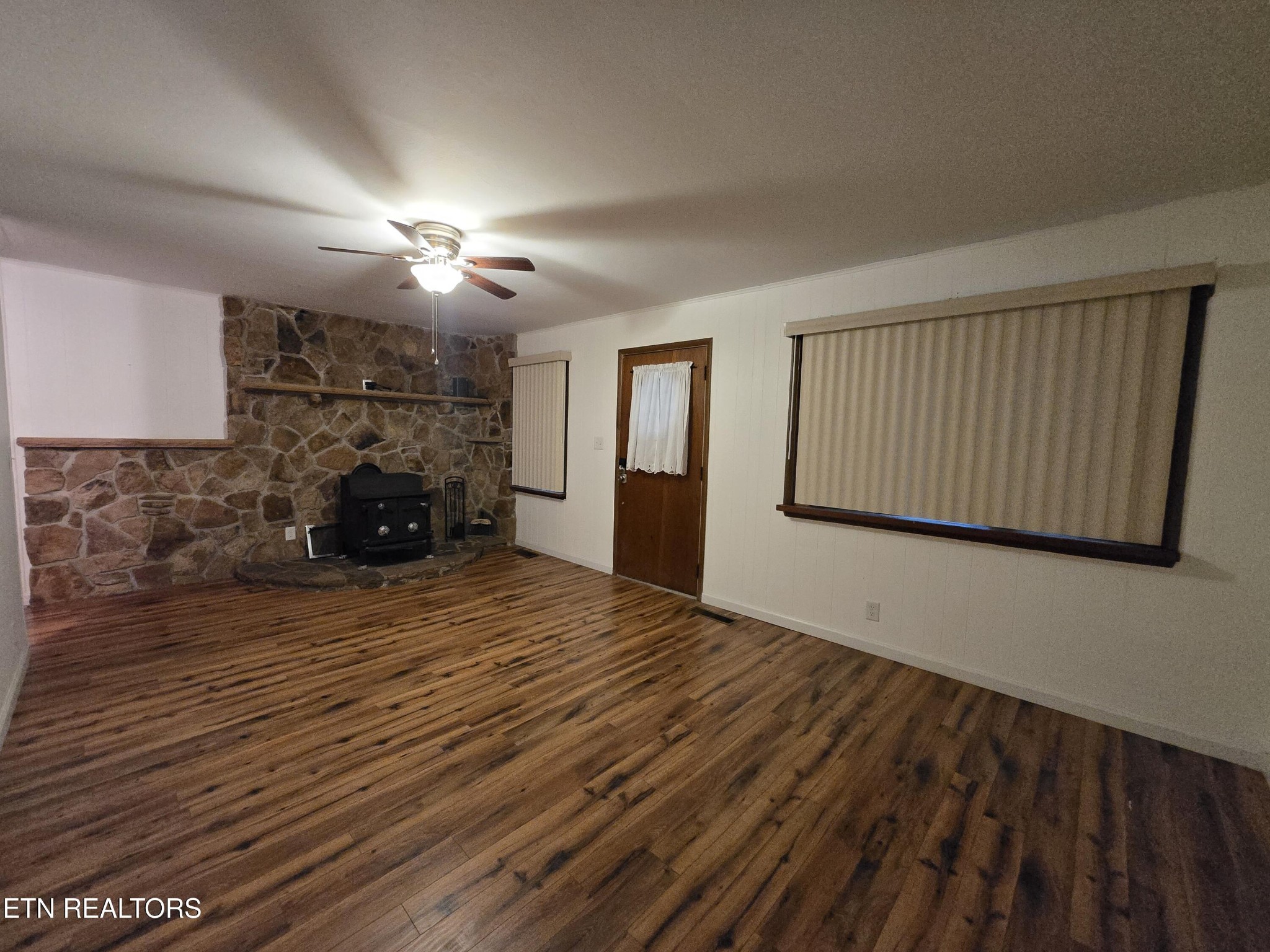 295 Bilbrey Road Crossville, TN 38571 - Photo 4 of 32 a view of empty room with a fireplace