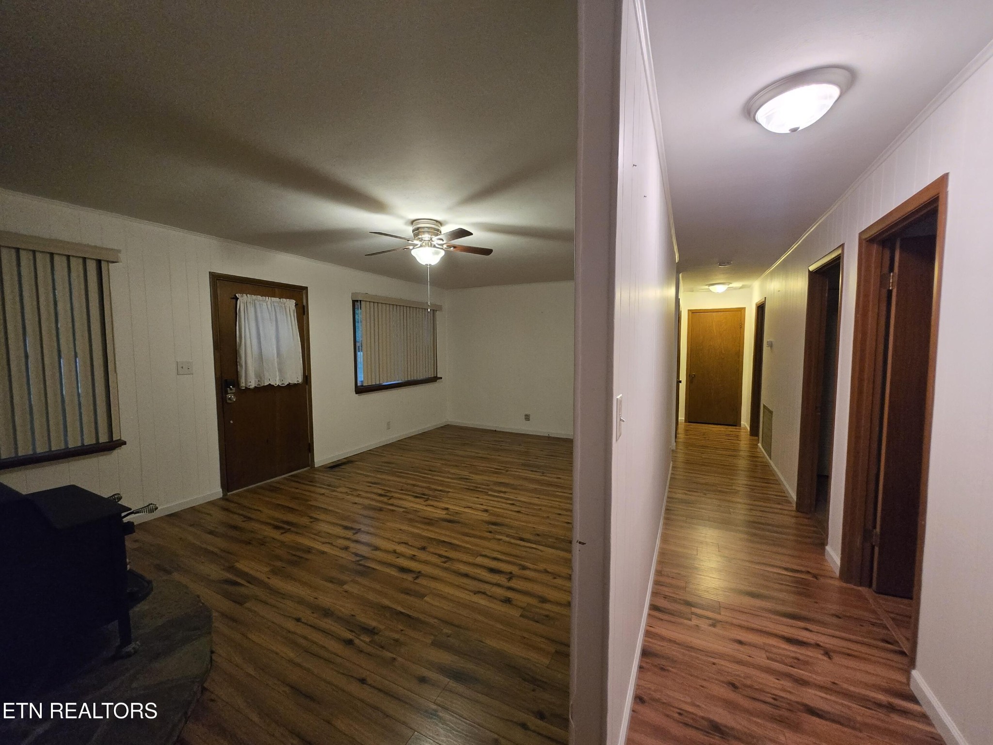 295 Bilbrey Road Crossville, TN 38571 - Photo 6 of 32 a view of a hallway view with wooden floor and staircase