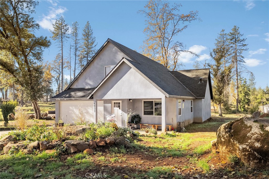6033 Pentz Road Paradise, CA 95969 - Photo 14 of 54 a white house with a large tree in front of it