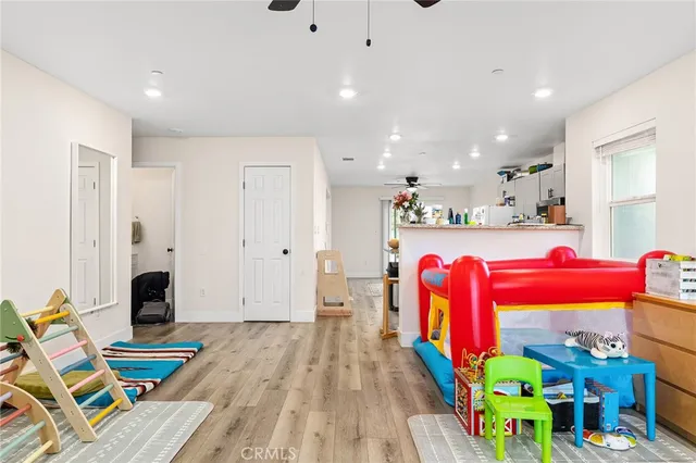 a kitchen that has a lot of cabinets and wooden floor