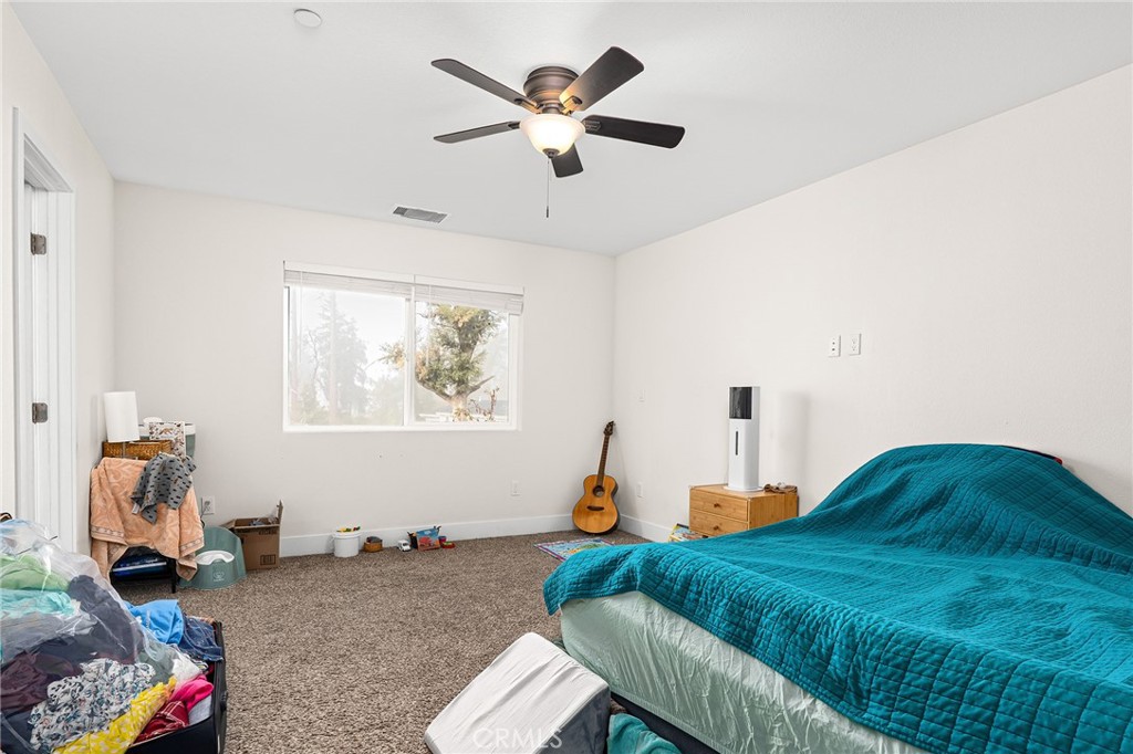 6033 Pentz Road Paradise, CA 95969 - Photo 22 of 54 a living room with furniture and a chandelier