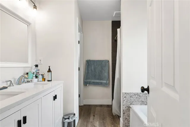 a white toilet sitting in a bathroom next to a sink