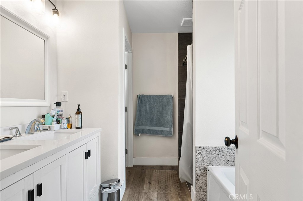 6033 Pentz Road Paradise, CA 95969 - Photo 26 of 54 a bathroom with a sink vanity and tub