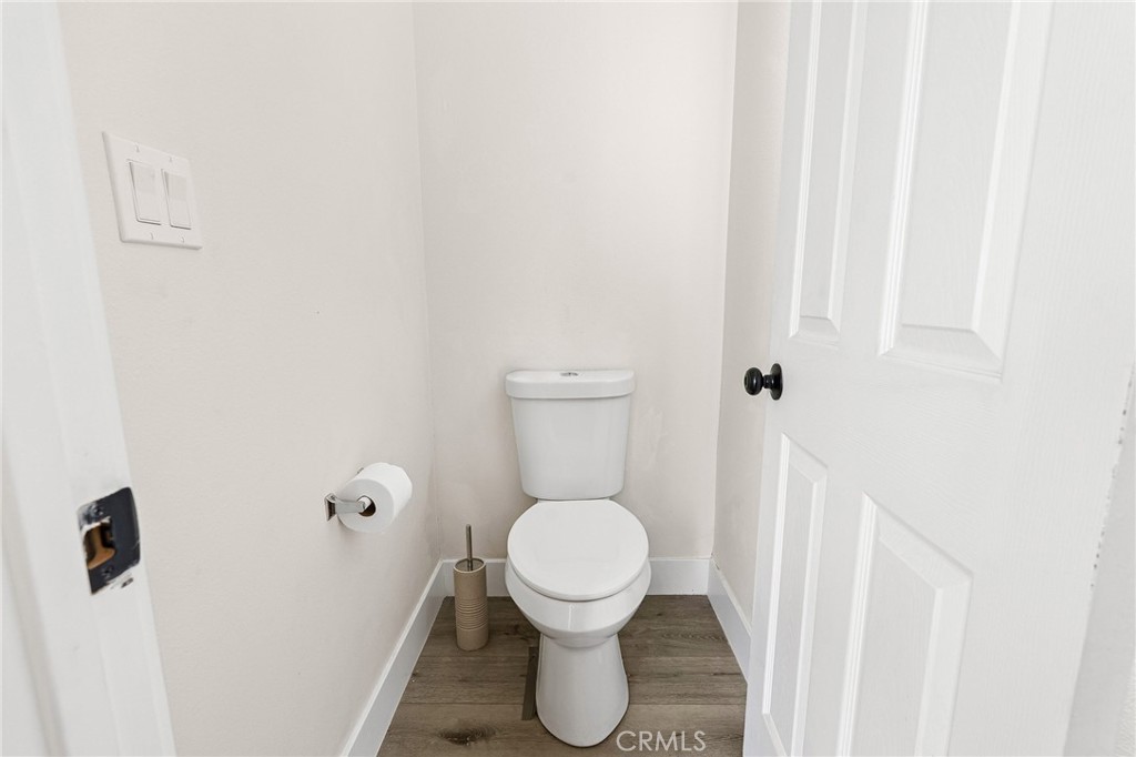 6033 Pentz Road Paradise, CA 95969 - Photo 27 of 54 a white toilet sitting in a bathroom next to a sink