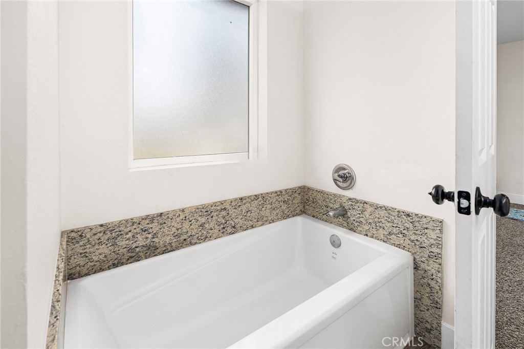 6033 Pentz Road Paradise, CA 95969 - Photo 28 of 54 a bathroom with a bathtub