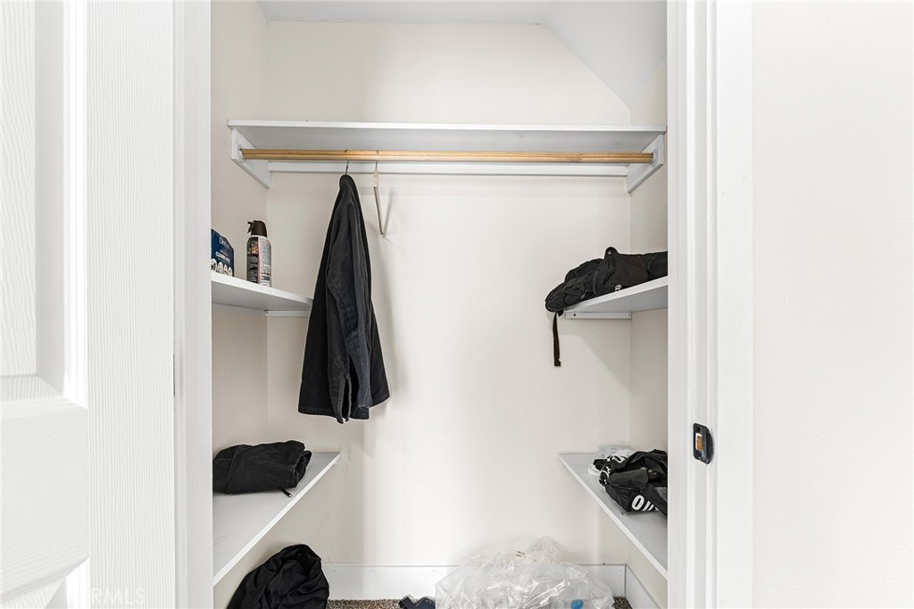 6033 Pentz Road Paradise, CA 95969 - Photo 40 of 54 a close view of walk in closet with clothes and shoes