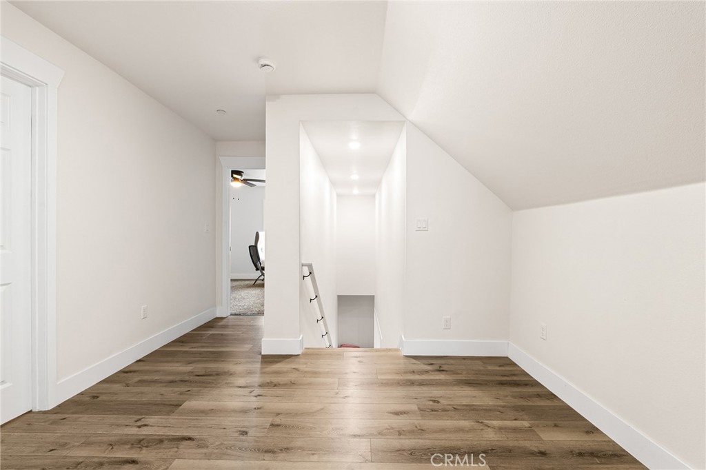 6033 Pentz Road Paradise, CA 95969 - Photo 41 of 54 a view of an empty room with wooden floor and a window