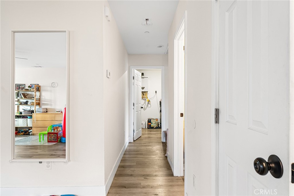 6033 Pentz Road Paradise, CA 95969 - Photo 44 of 54 a view of a hallway with wooden floor and closet