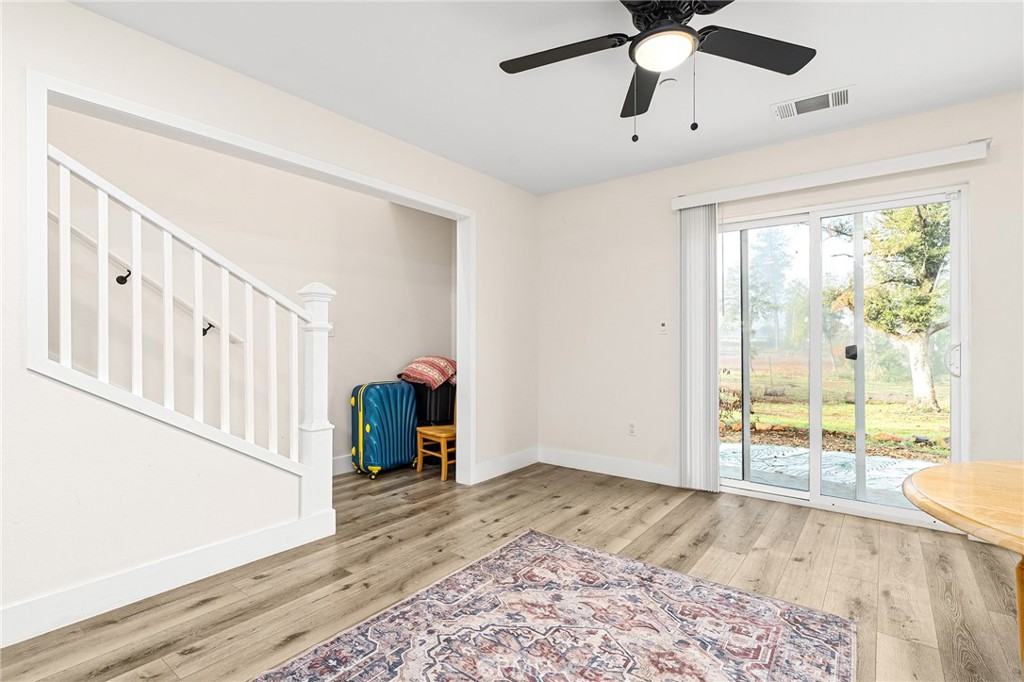 6033 Pentz Road Paradise, CA 95969 - Photo 5 of 54 wooden floor in an empty room with a window