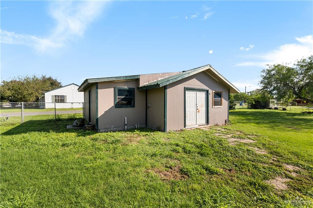 310 North Arroyo Boulevard Rio Hondo, TX 78583 - Photo 21 of 31 a front view of a house with garden