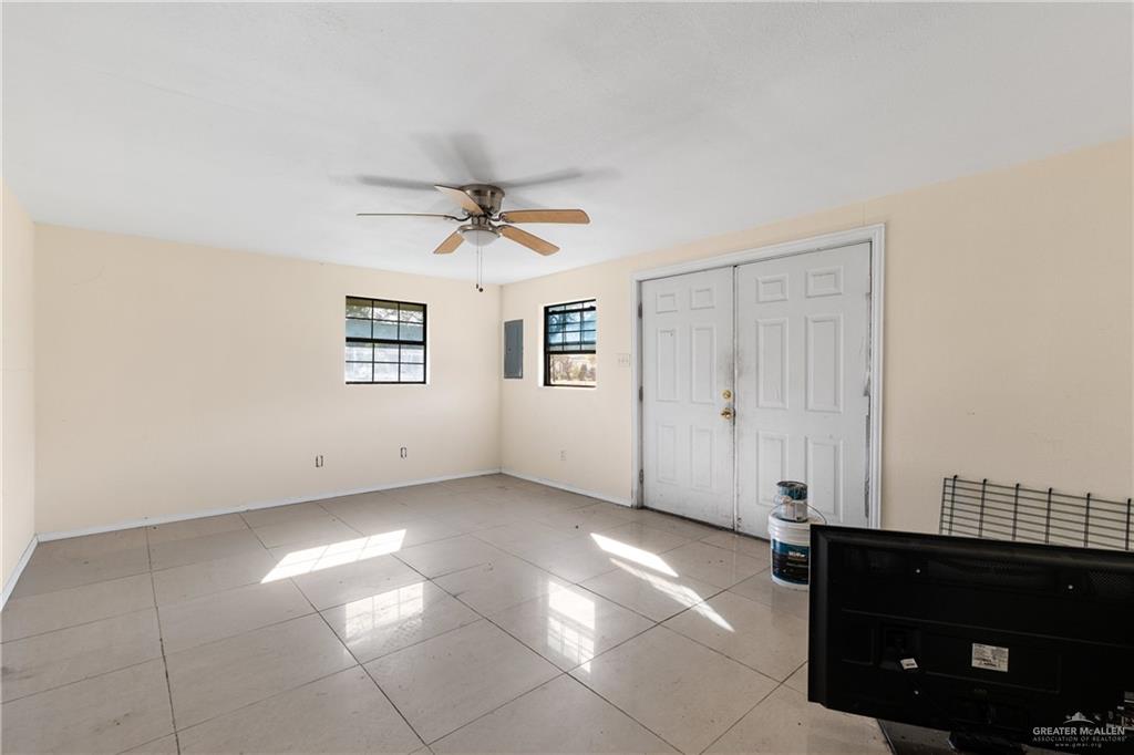 310 North Arroyo Boulevard Rio Hondo, TX 78583 - Photo 22 of 31 a view of a livingroom with a ceiling fan and window