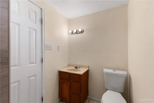 an aerial view of a house with a yard and potted plants