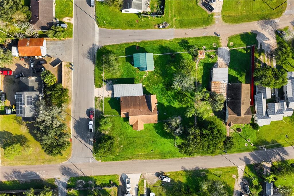 310 North Arroyo Boulevard Rio Hondo, TX 78583 - Photo 26 of 31 an aerial view of a house with a yard and potted plants