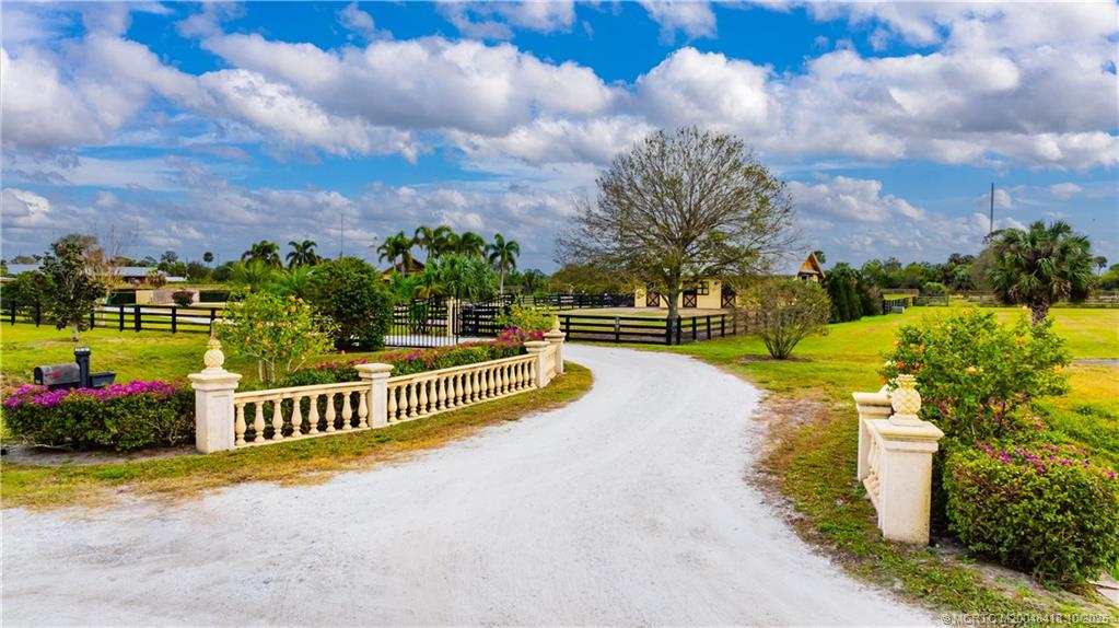 7625 Polo Square Vero Beach, FL 32968 - Photo 20 of 35 a view of a house with a garden