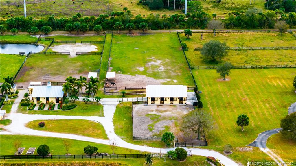 7625 Polo Square Vero Beach, FL 32968 - Photo 24 of 35 an aerial view of residential houses with outdoor space and swimming pool