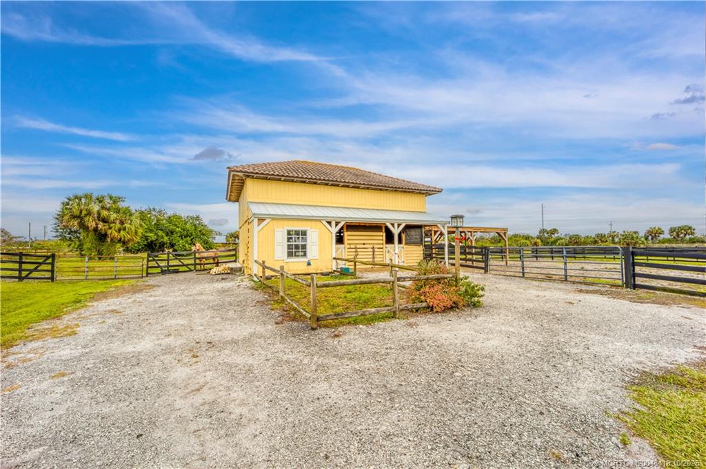 7625 Polo Square Vero Beach, FL 32968 - Photo 29 of 35 a view of a house with backyard and sitting area