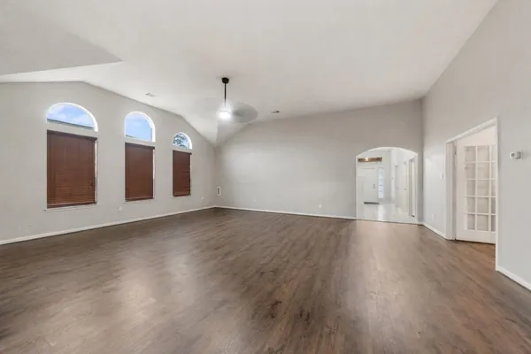 a kitchen with stainless steel appliances granite countertop a stove refrigerator sink and microwave