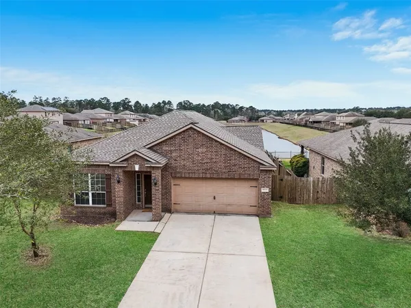 an aerial view of a house with a outdoor space