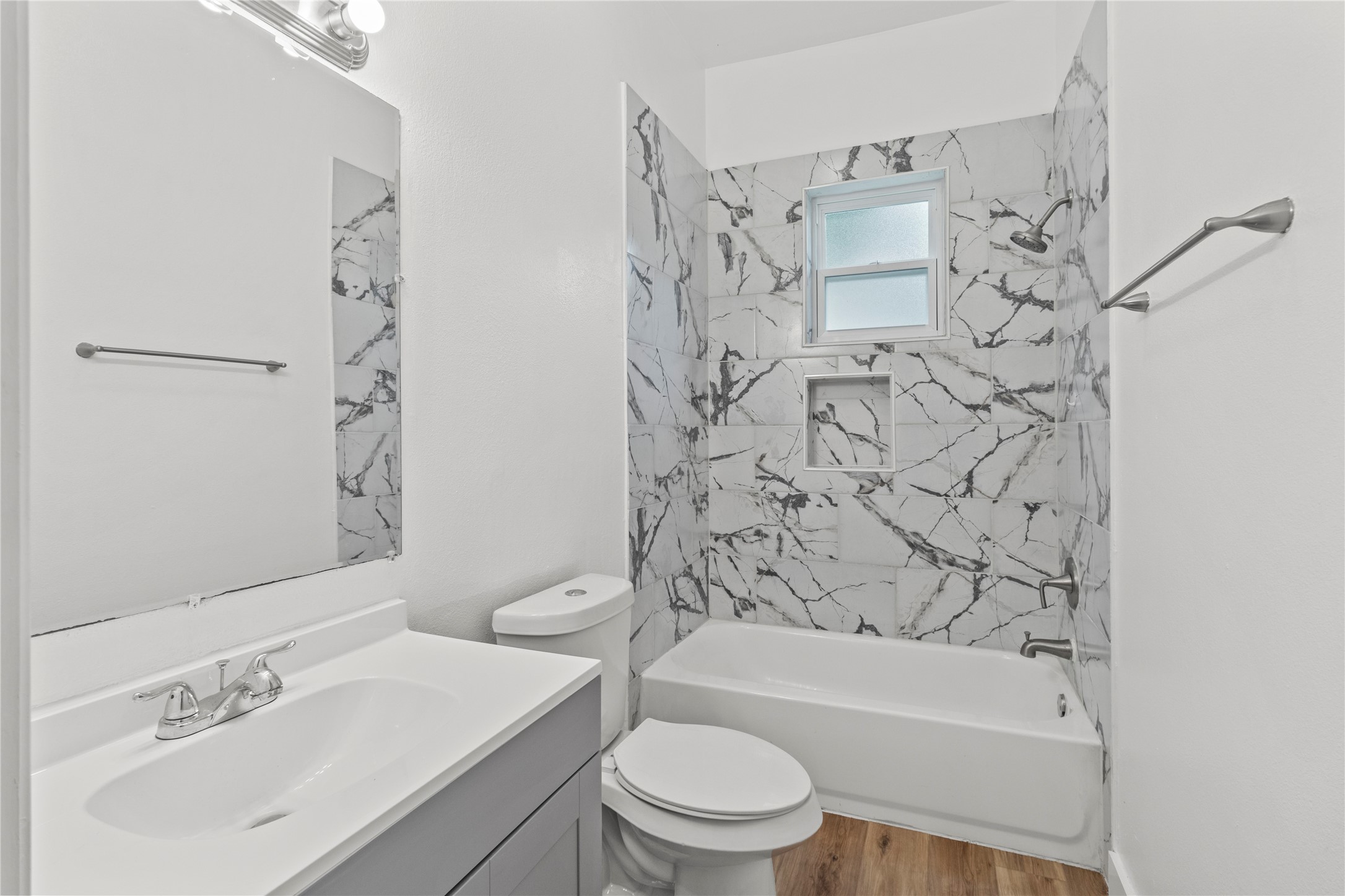 436 East Peach Street, Unit B Angleton, TX 77515 - Photo 7 of 7 a bathroom with a sink toilet and shower