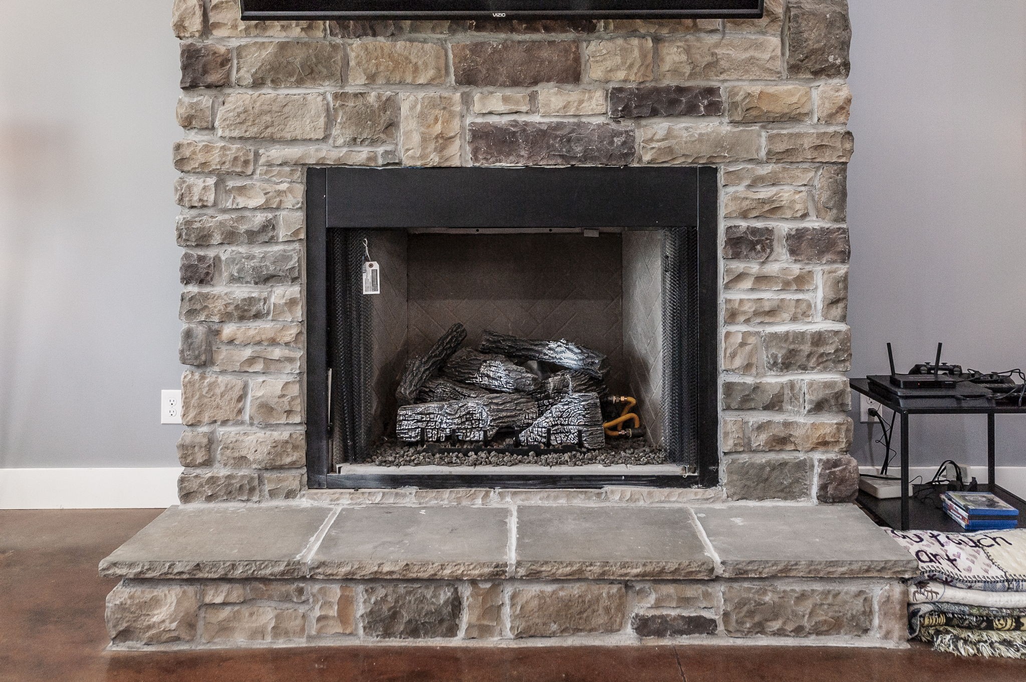223 Cedar Hill Road Adams, TN 37010 - Photo 19 of 51 a fireplace with a vase on top of it