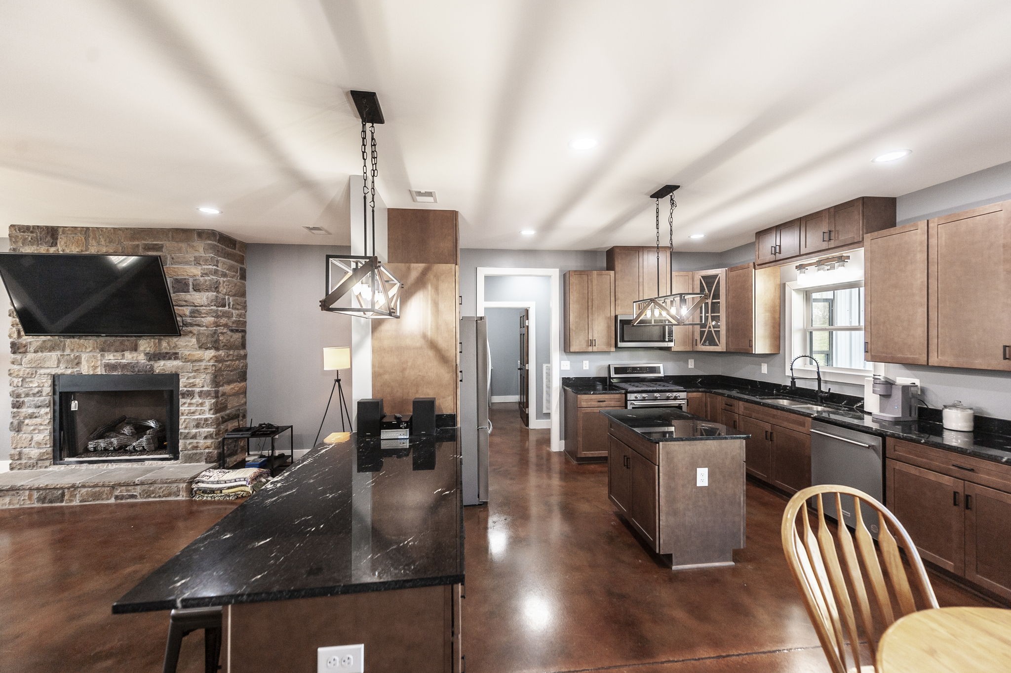 223 Cedar Hill Road Adams, TN 37010 - Photo 22 of 51 a kitchen with stainless steel appliances granite countertop a sink a stove and a refrigerator