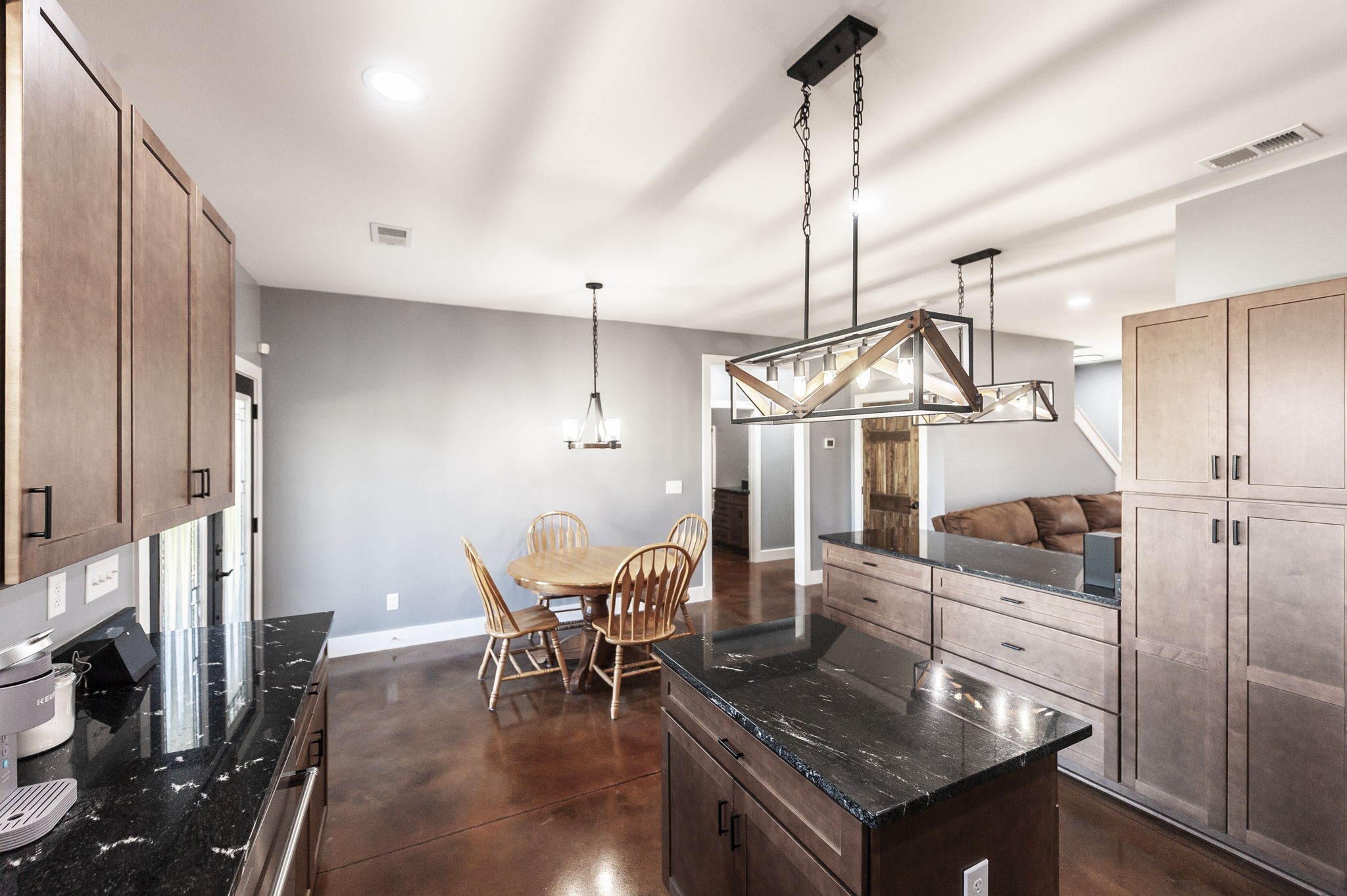 223 Cedar Hill Road Adams, TN 37010 - Photo 24 of 51 a kitchen with stainless steel appliances granite countertop a stove refrigerator and chairs