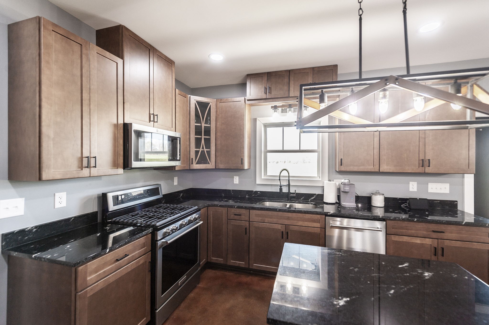 223 Cedar Hill Road Adams, TN 37010 - Photo 26 of 51 a kitchen with granite countertop a sink stainless steel appliances and cabinets