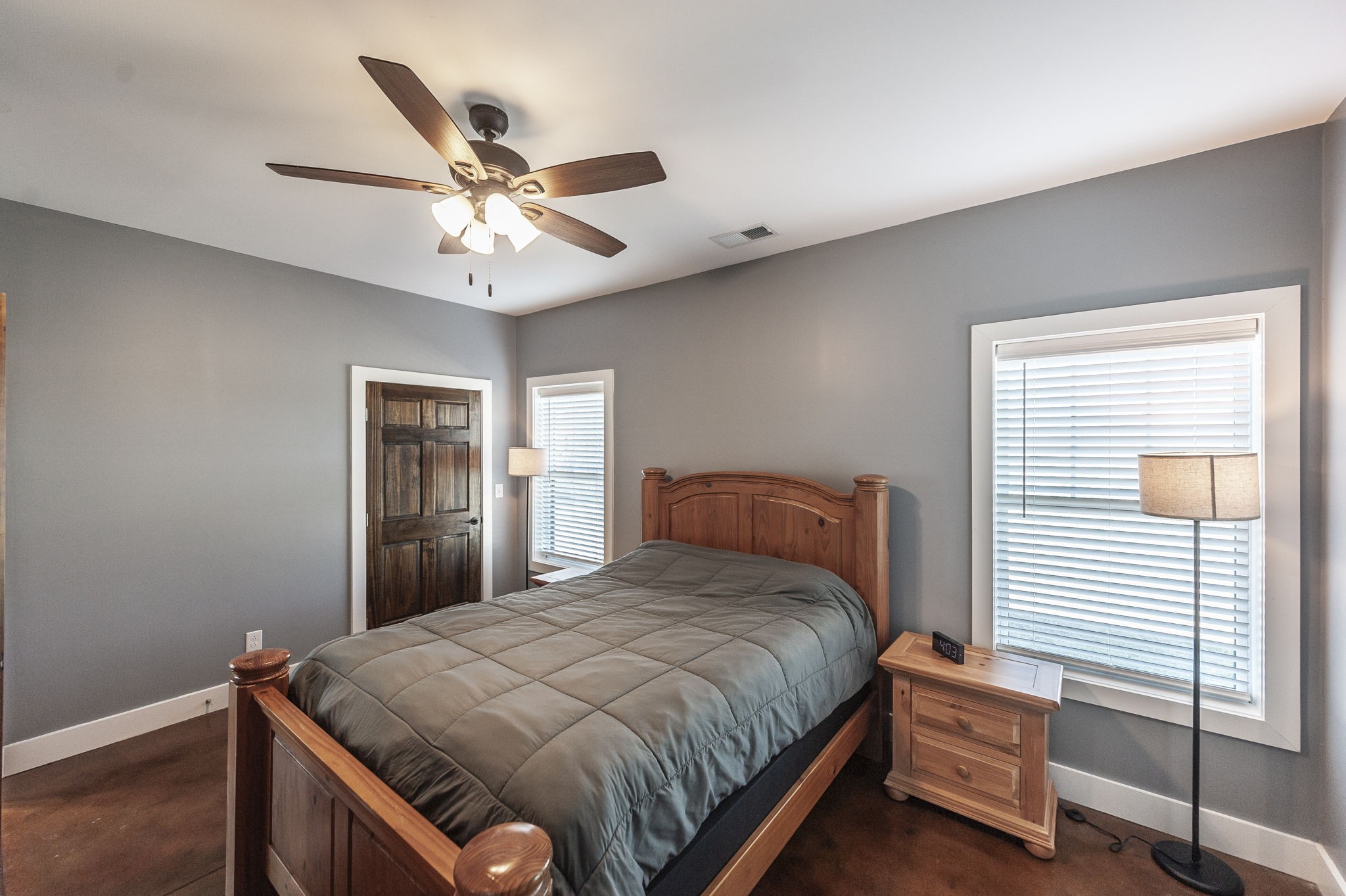223 Cedar Hill Road Adams, TN 37010 - Photo 28 of 51 a bedroom with a bed and a chandelier