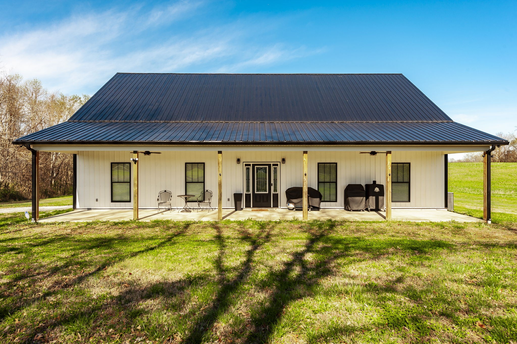 223 Cedar Hill Road Adams, TN 37010 - Photo 4 of 51 a big house with swimming pool in front of it
