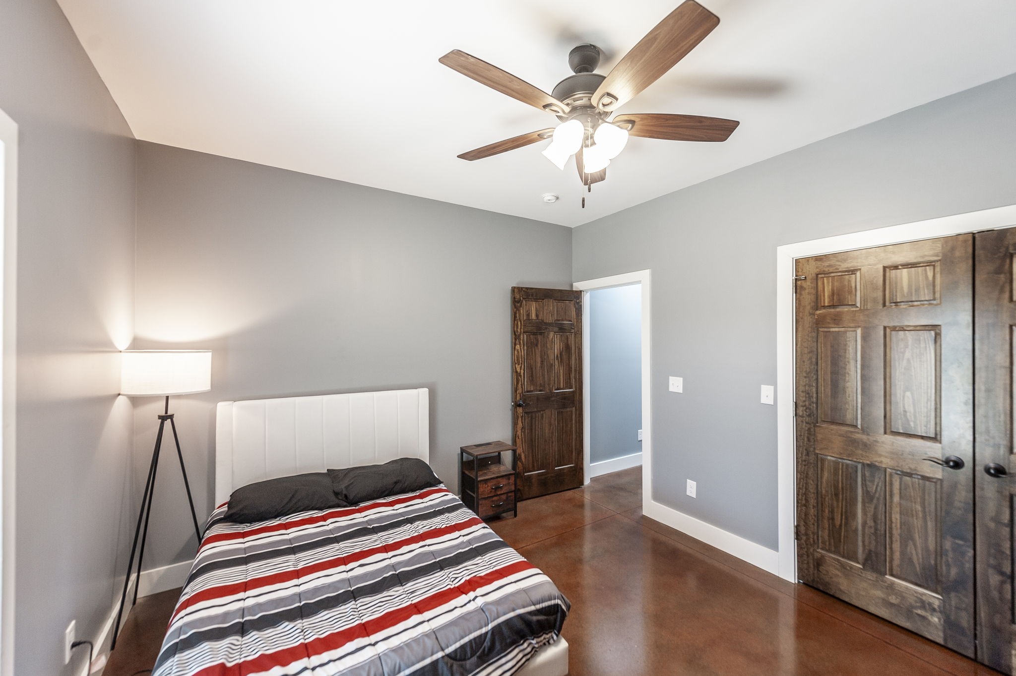 223 Cedar Hill Road Adams, TN 37010 - Photo 41 of 51 a bedroom with bed and a chandelier