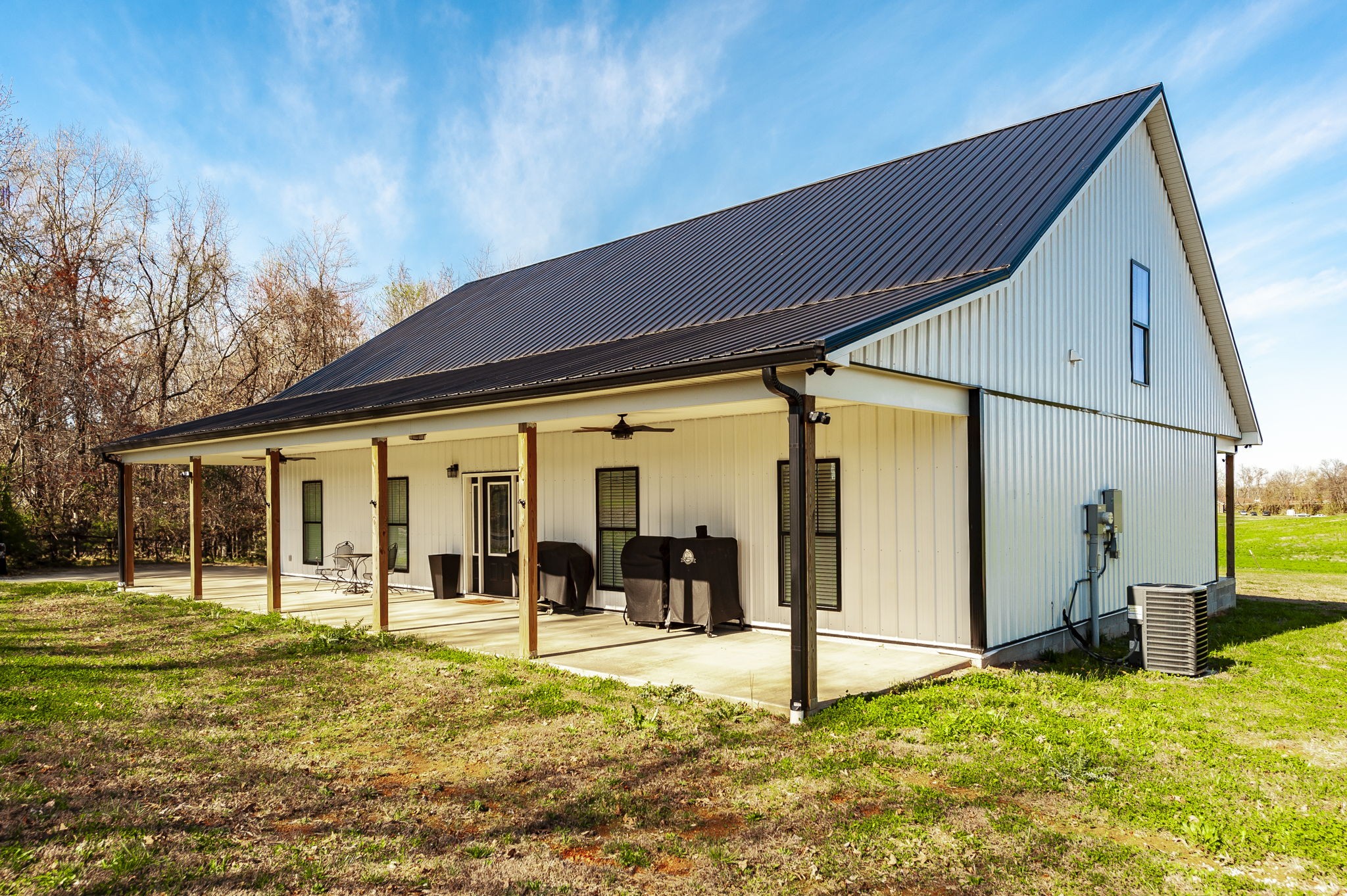 223 Cedar Hill Road Adams, TN 37010 - Photo 5 of 51 a backyard of a house with table and chairs