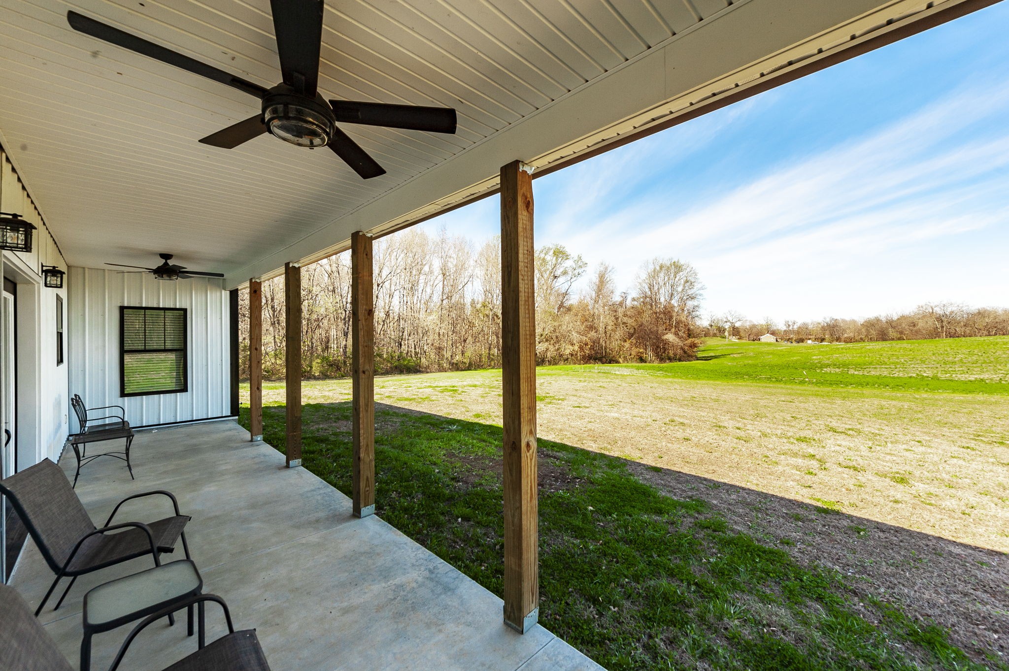 223 Cedar Hill Road Adams, TN 37010 - Photo 7 of 51 a view of a living room and floor to ceiling window