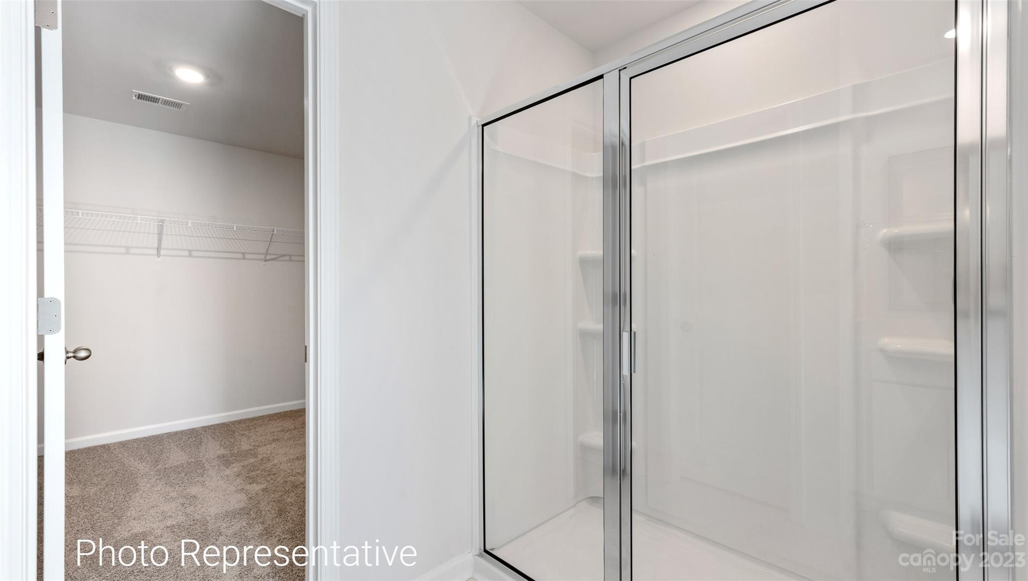 116 Wheatfield Road Fletcher, NC 28732 - Photo 25 of 29 a bathroom with a glass shower door