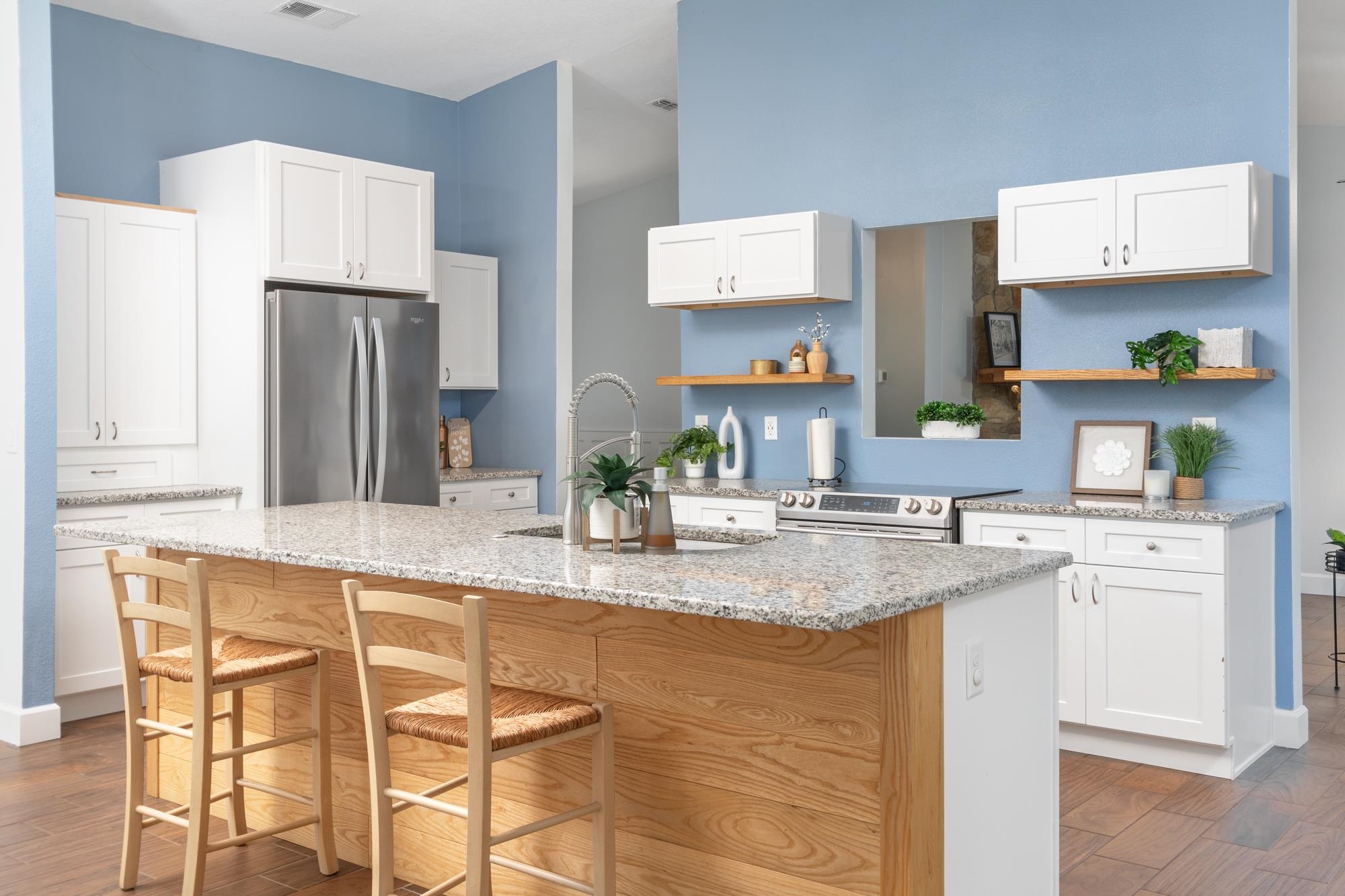 245 Mimosa Road St. Augustine, FL 32086 - Photo 21 of 33 a kitchen with stainless steel appliances granite countertop a sink and a refrigerator