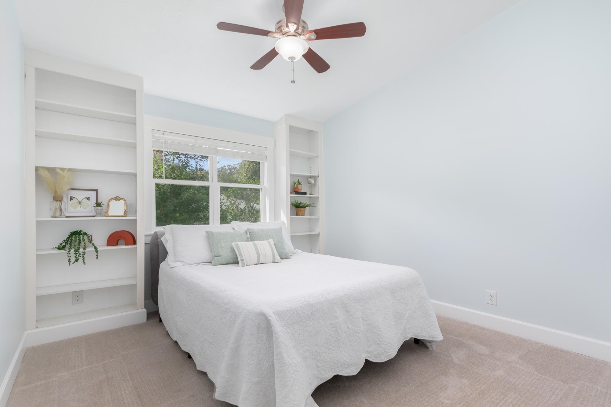 245 Mimosa Road St. Augustine, FL 32086 - Photo 4 of 33 a bedroom with a bed and a window