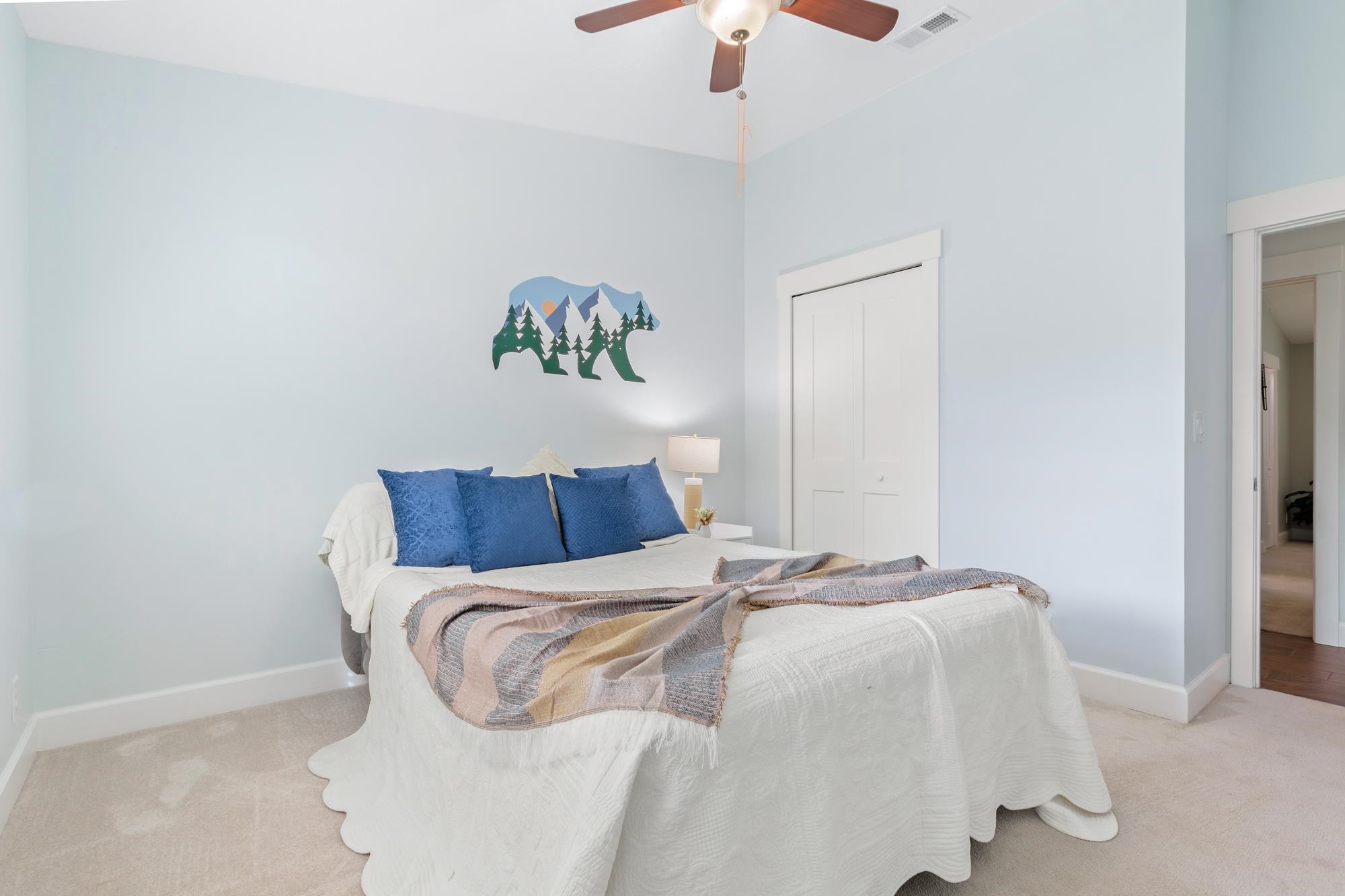 245 Mimosa Road St. Augustine, FL 32086 - Photo 8 of 33 a bedroom with a bed and a chandelier