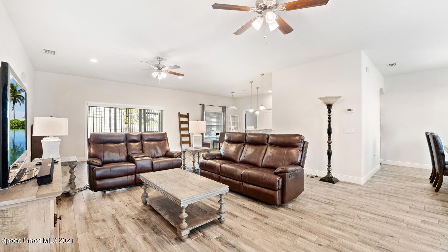 942 Carver Road Southeast Palm Bay, FL 32909 - Photo 8 of 26 a living room with furniture