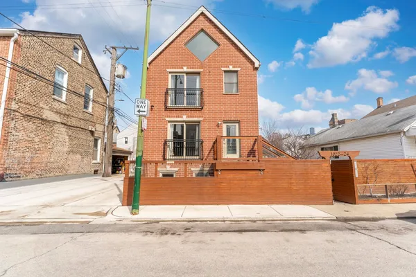 a view of a house with a street