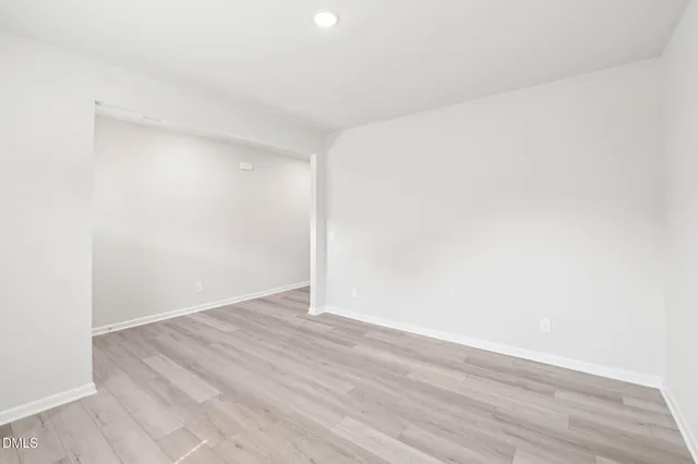 a kitchen with stainless steel appliances granite countertop a refrigerator sink and stove