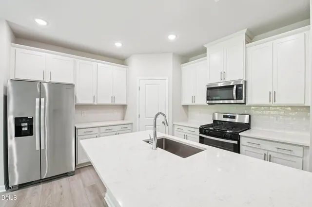 a bathroom with a sink double vanity and a mirror