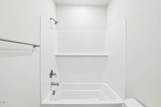 a bathroom with 2 sink and a mirror