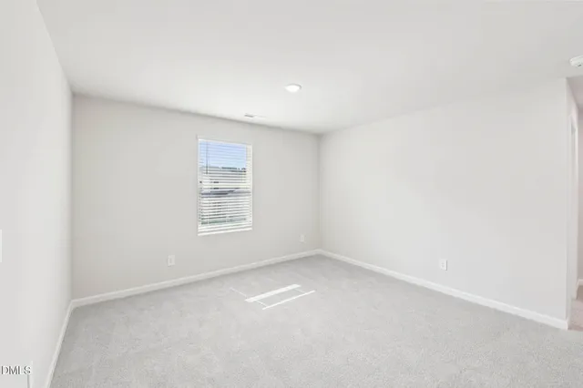 a bathroom with a bathtub and a toilet