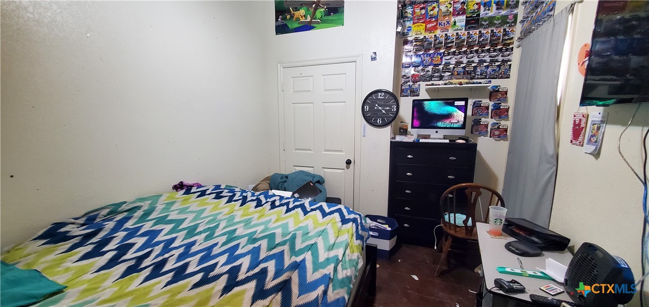 2201 Valley Forge Avenue Temple, TX 76504 - Photo 15 of 15 a bedroom with a bed and a dresser in it